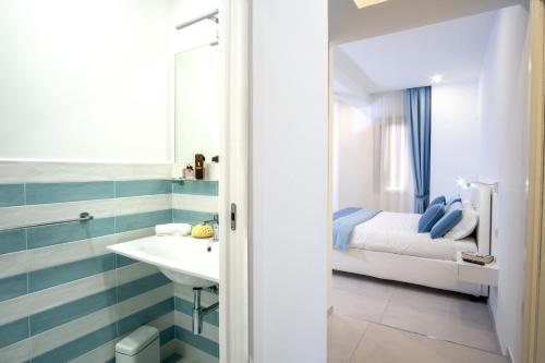 Ванная комната в LEONE ROSSO APARTMENTs