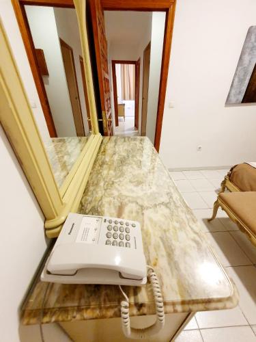 a phone sitting on a counter in a room at Hotel Marítimo Urban in Alicante