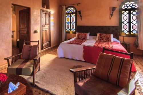 Una cama o camas en una habitación de Kasbah Tabelkoukt
