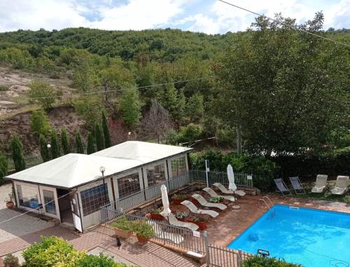 an overhead view of a house with a pool at Selvicolle Country House in Crispiero