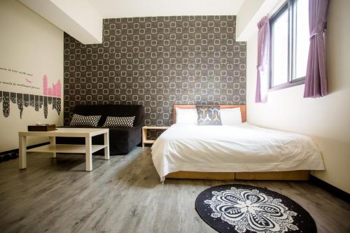 Postel nebo postele na pokoji v ubytování 台中住宿