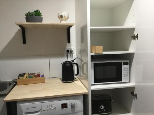 A cozinha ou cozinha compacta de Riverlands Homestay