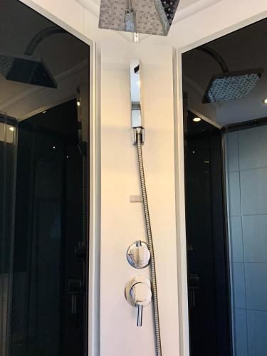 a door with a water hose hooked up to it at Chez Nous en fait in Salzburg
