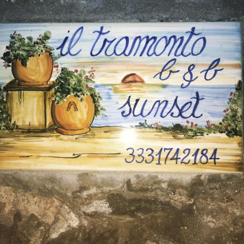 a sign for a restaurant with pumpkins on it at B&B The Sunset in Anacapri
