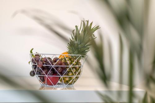 a bowl of fruit sitting on top of a table at Hvar de luxe apartments 1 in Hvar