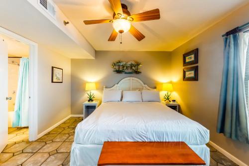 a bedroom with a bed and a ceiling fan at Phoenix III in Orange Beach