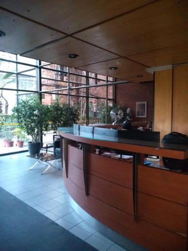 a lobby with a large counter in a building at Apartamentos Costanera Centre in Santiago