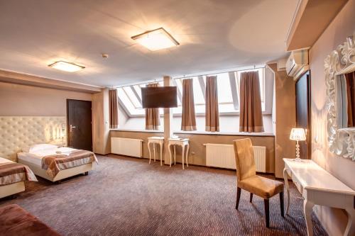 Posteľ alebo postele v izbe v ubytovaní Hotel Jedlinka