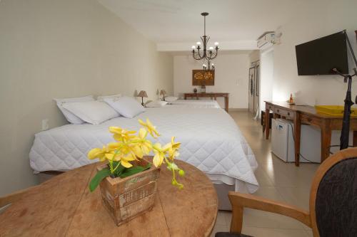 Ένα ή περισσότερα κρεβάτια σε δωμάτιο στο Hotel Serra Vista