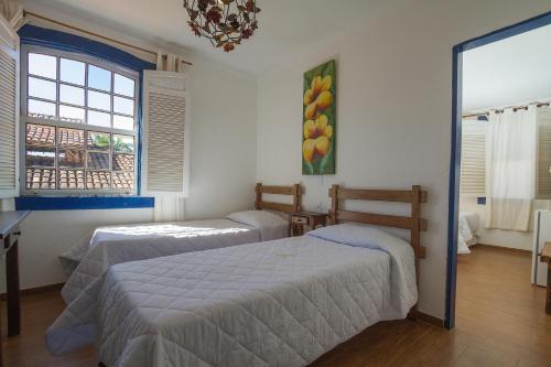 Ένα ή περισσότερα κρεβάτια σε δωμάτιο στο Hotel Serra Vista