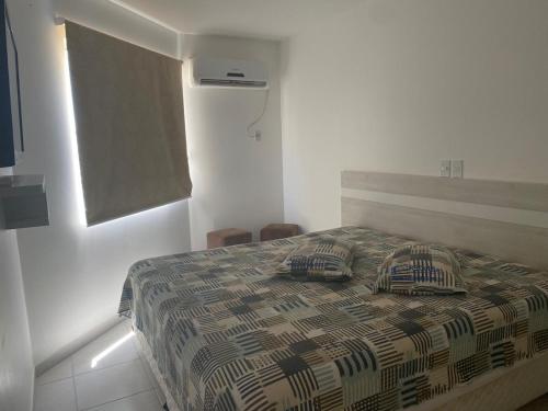 Cama o camas de una habitación en Prive das Thermas II (RPT 2)