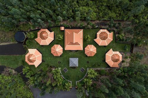 an overhead view of a garden with umbrellas at Volcano Eco Retreat by Heart Core Hotels - Adults Only in Mountain View