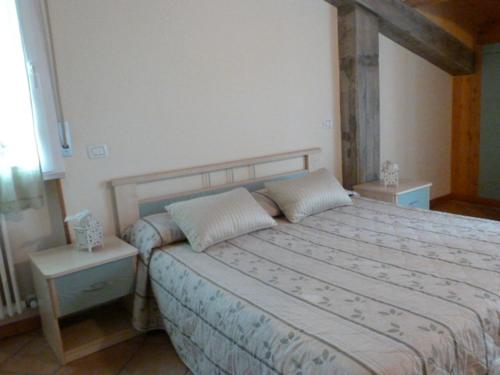Postel nebo postele na pokoji v ubytování Appartamenti Belle Vacanze