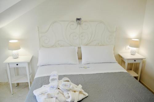 a bedroom with a bed with towels on it at Relais Bellavista B&B in Casalnuovo di Napoli