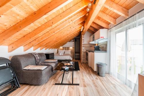 a living room with a couch and a table at Casa do Bairro by CosyCasa Praia Peniche in Peniche