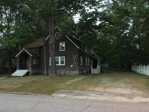 a house with a x painted on the side of it at Snowchasers Lodge in Lincoln