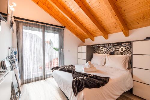 Ein Bett oder Betten in einem Zimmer der Unterkunft Casa das Rendas by CosyCasa Praia Peniche