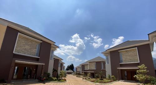 a row of houses on a street at Marseillia Hills in Puncak