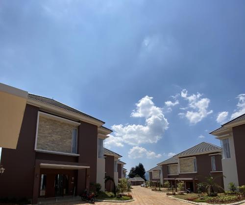 a row of houses on a street at Marseillia Hills in Puncak