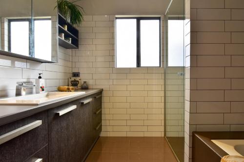 a kitchen with a sink and a shower at Arthouse Six in Margaret River Town