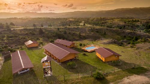 an aerial view of a house on a hill at Complejo Apus in La Cumbrecita
