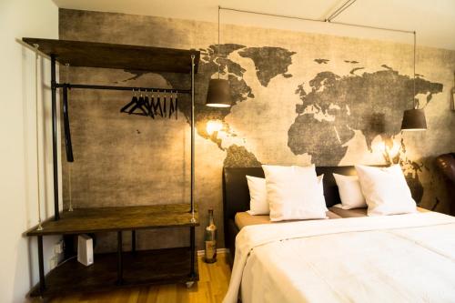 a bedroom with a map of the world on the wall at Little Beauty Souterrain Apartment Linkenheim in Linkenheim-Hochstetten