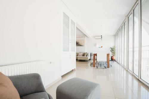 a living room with a couch and a table at Athens Studios in Athens