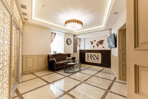 a living room with a couch and a fireplace at Hotel Natalia 18 in Lviv