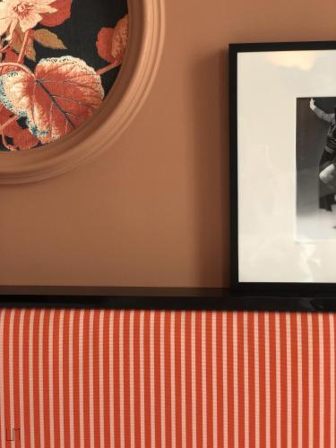 a picture frame on a wall with a mirror at Mercure Paris Gare De Lyon Opera Bastille in Paris