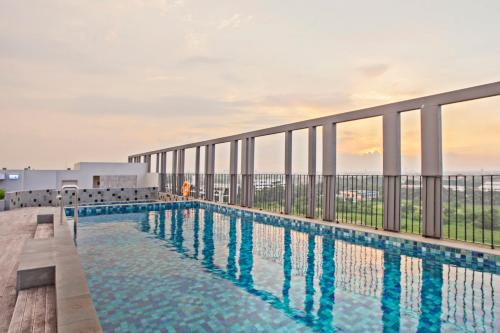 a swimming pool on the roof of a building at Swiss-Belinn Cikarang in Cikarang