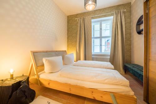 Кровать или кровати в номере Design Apartments -Innenstadt, Bäckerstr 8