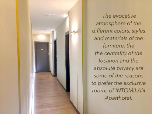 a hallway with a poem on the wall at INTOMILAN Galleria Duomo I Boutique & Design Aparthotel in Milan