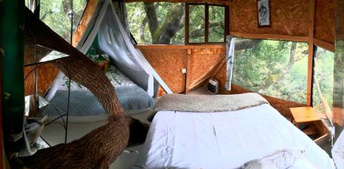 a bedroom with a bed in a tent at B&B La Cabane Insolite in Monès