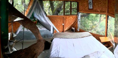 Postel nebo postele na pokoji v ubytování B&B La Cabane Insolite