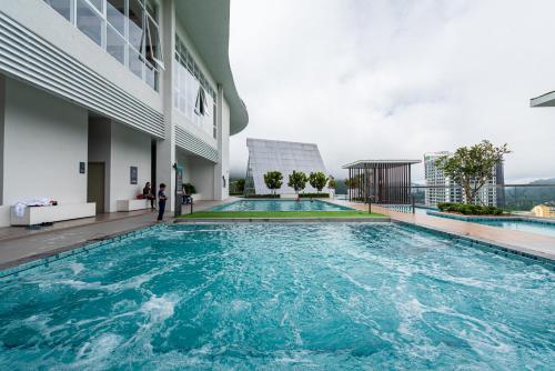 a swimming pool on the roof of a building at Genting Premium Suite Windmill Upon Hills by JAz Home Suites in Genting Highlands