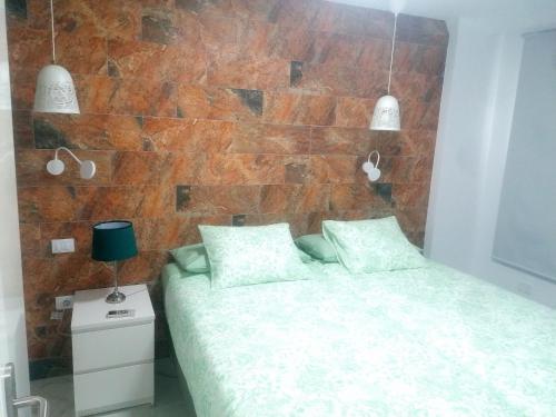 Postel nebo postele na pokoji v ubytování PLAYA DEL INGLES LOS MOLINOS 115