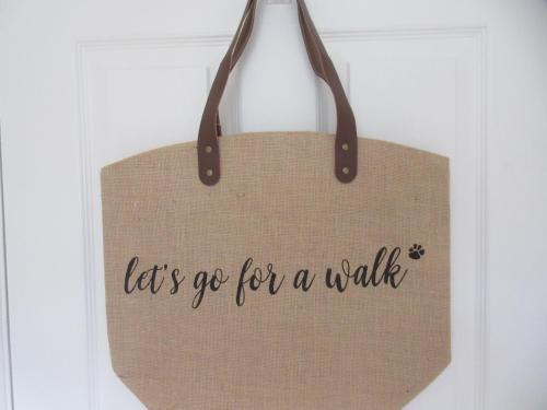 a bag that says let s go for a walk at 225 Buttercup Swanage Bay View - Vacation Home in Swanage