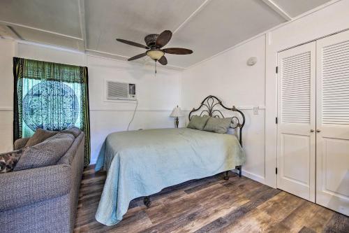 a bedroom with a bed and a ceiling fan at Pet-Friendly Canyon Lake Studio Fish, Boat, Relax in Canyon Lake