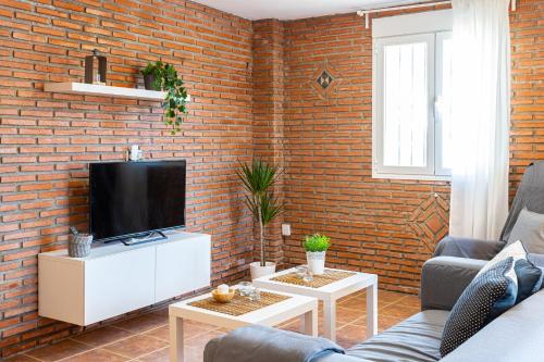 TV a/nebo společenská místnost v ubytování Apartamento Alberti