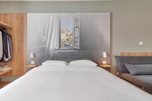 Postel nebo postele na pokoji v ubytování B&B HOTEL Pau Lescar