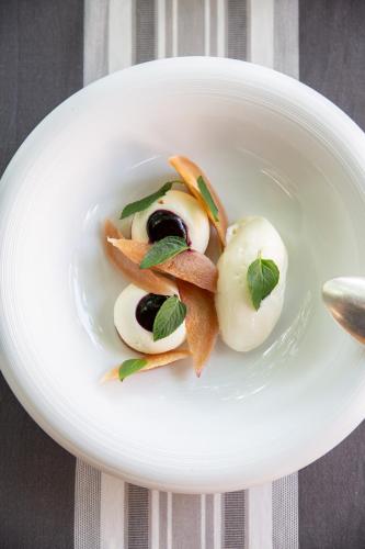 a white bowl filled with food on a table at Le Florida Auberge contemporaine in Castéra-Verduzan