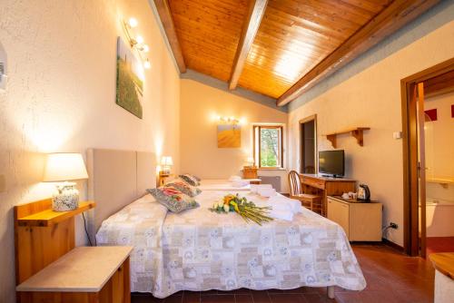 Postel nebo postele na pokoji v ubytování Hotel Palazzuolo