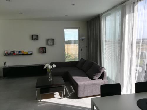 a living room with a couch and a table at Apartmán Polička in Polička