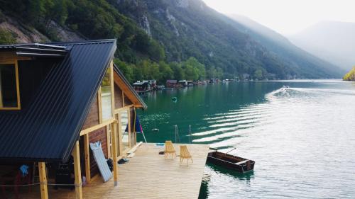 a house on a dock on a lake at Lake House Perucac in Rastište