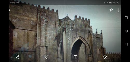an old stone building with an arch in front of it at Apartamento Tui, Casa da Barca in Tui