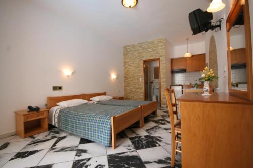 Postel nebo postele na pokoji v ubytování Aegeon Hotel