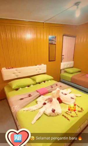 Perhentian AB Guest Houseにあるベッド