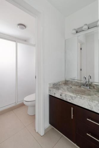 a bathroom with a sink and a toilet at Acogedora Suite Alberca Bernardo Quintana 3B in Mendiola