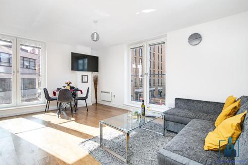 a living room with a couch and a table at City View Apartments in Birmingham