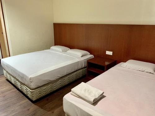 Postel nebo postele na pokoji v ubytování New Grand Hotel